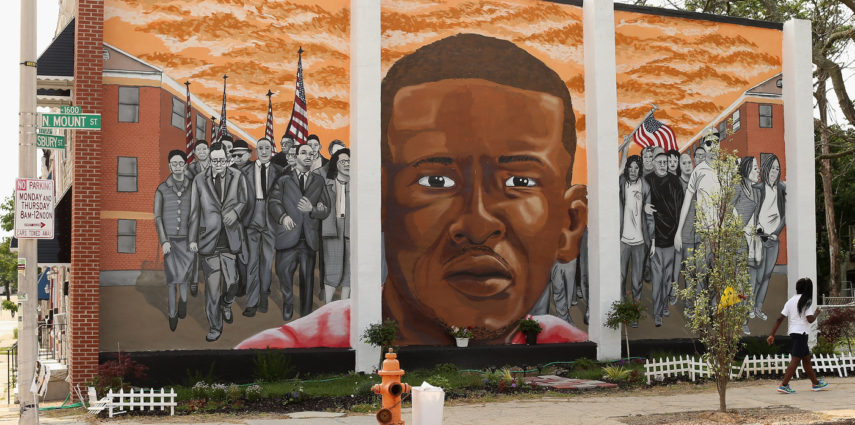 A mural memorializing Baltimore resident Freddie Gray adorns a wall near the place where he was tackled and arrested by police. <em>The Baltimore Sun</em> says it has acquired a copy of the unreleased government autopsy report in the case.